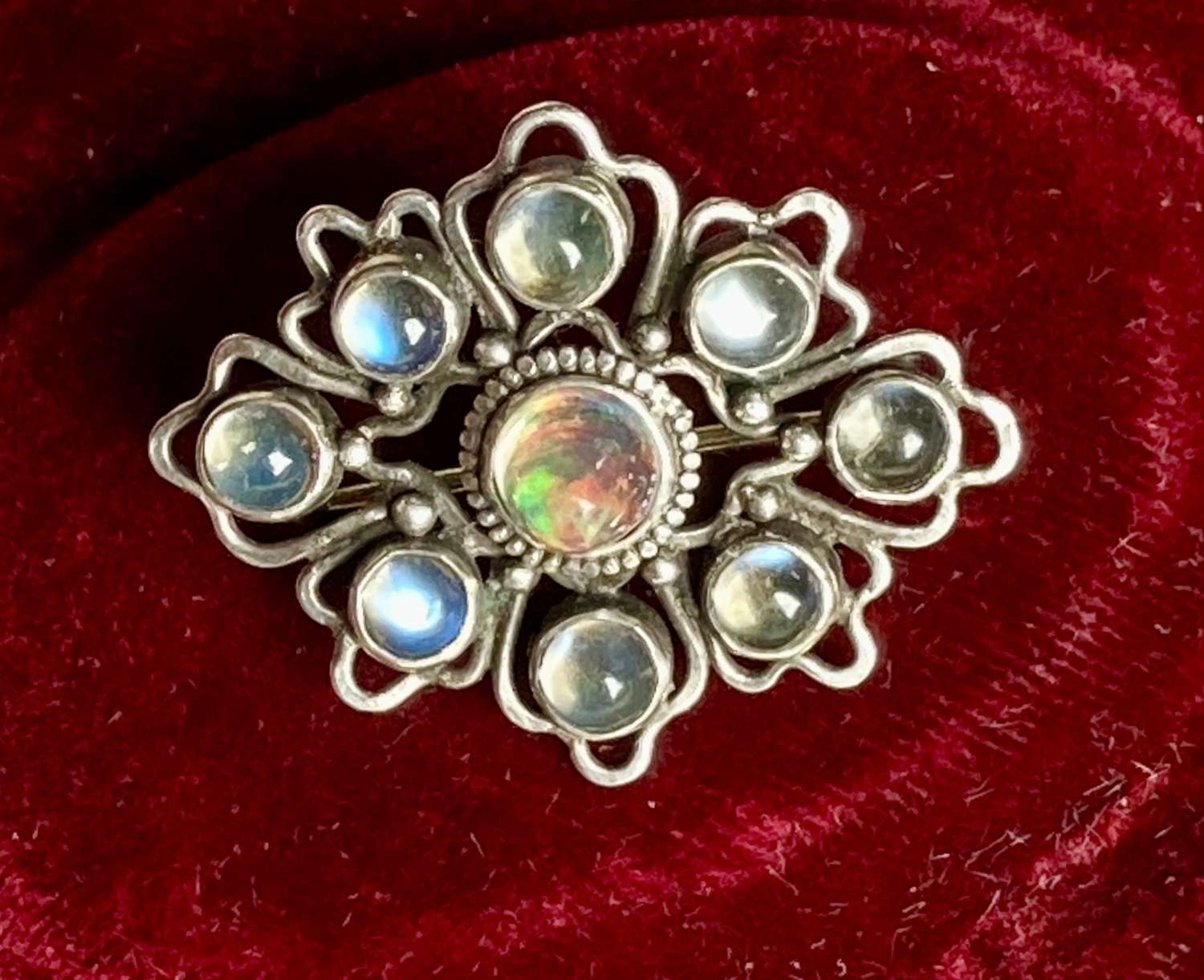 A Liberty & Co opal, moonstone and silver brooch