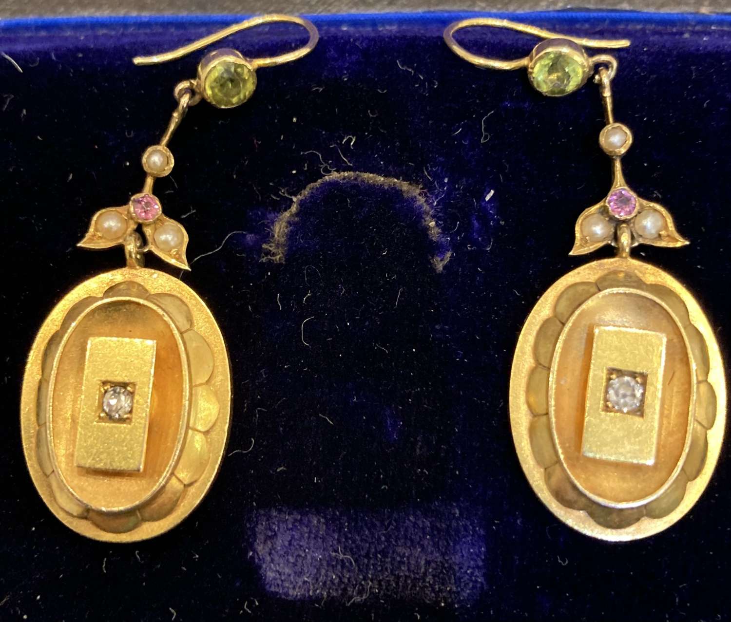 A pair of Suffragist diamond, tourmaline, peridot earrings